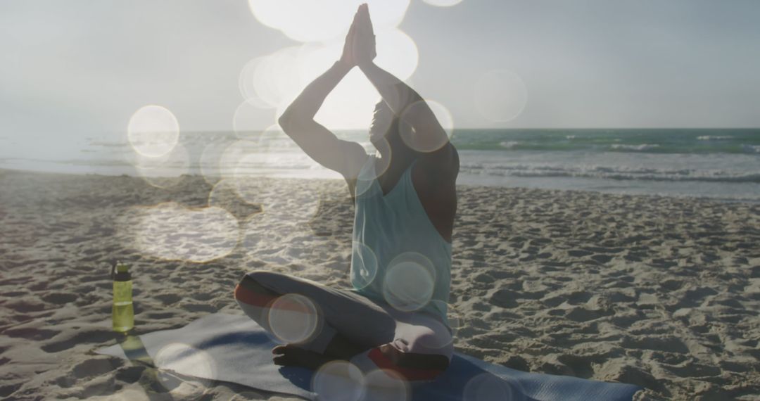 Man Meditating on Sunlit Beach Serenity and Reflection