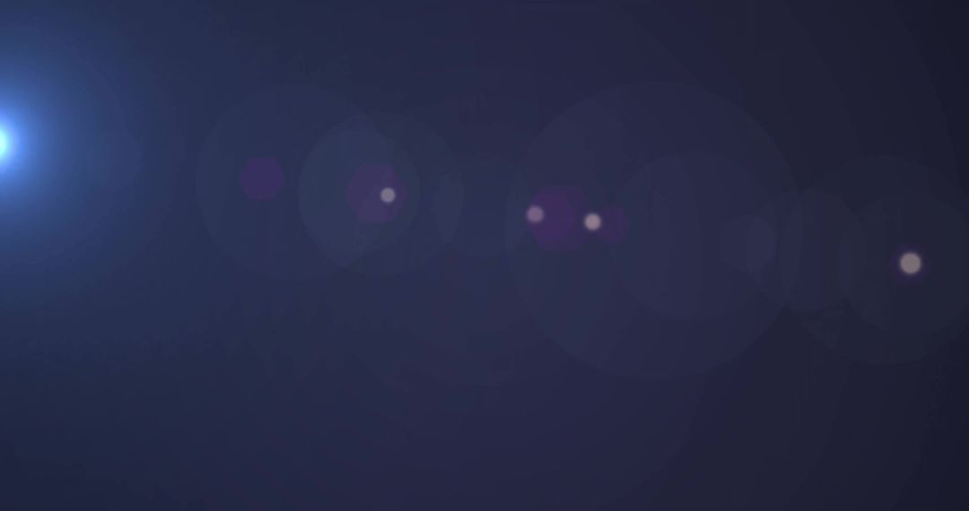 Abstract Light Flares on Dark Blue Background