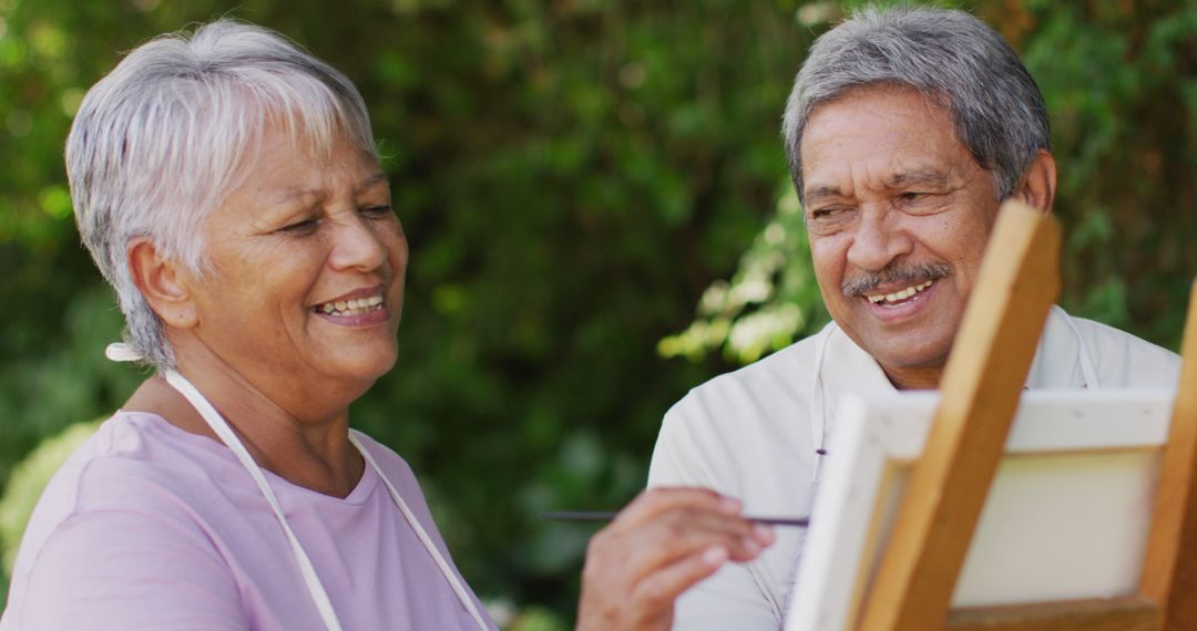 Image of happy biracial senior couple painting in garden - Free Images, Stock Photos and Pictures on Pikwizard.com