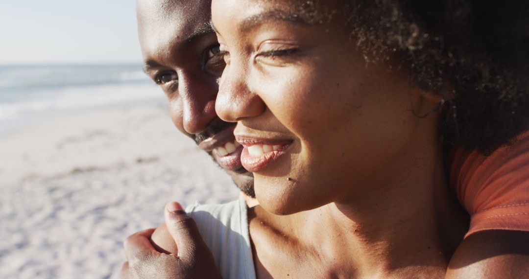 Close-Up of Happy African American Couple Embracing on Beach - Free Images, Stock Photos and Pictures on Pikwizard.com