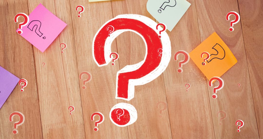 Red Question Mark with Colorful Notes on Wooden Surface Background
