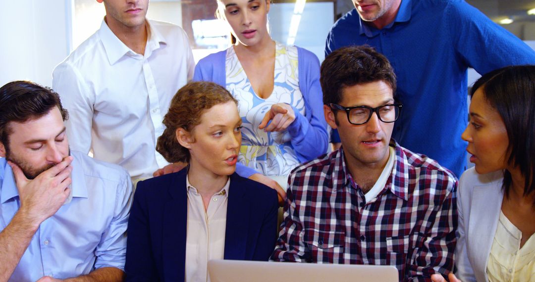 Diverse Team Engaging in a Lively Office Meeting