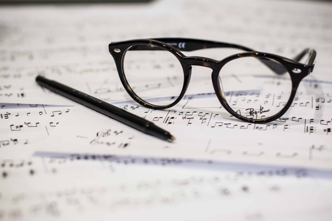 Glasses and Pen on Sheet Music with Musical Notes - Free Images, Stock Photos and Pictures on Pikwizard.com