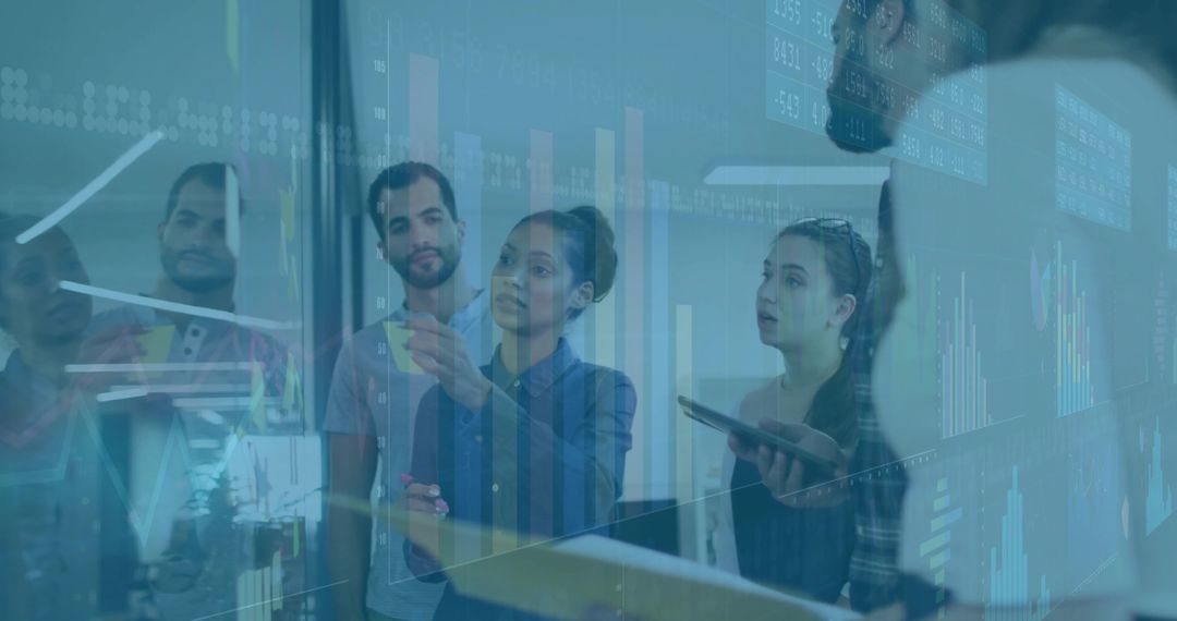 Team Discussing Data Insights Showing Graphs on Office Glass Wall