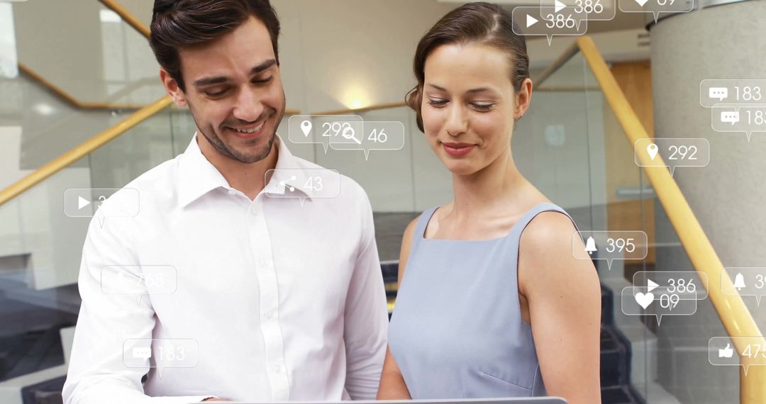 Business Colleagues Analyzing Data with Social Media Icons Overlay