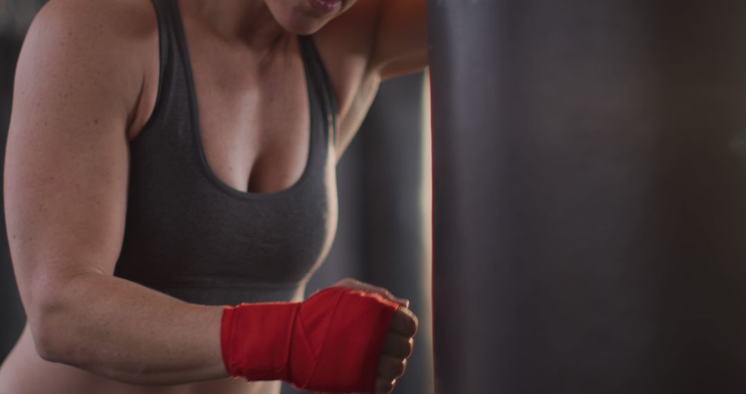 Female Boxer With Red Hand Wraps Resting - Free Images, Stock Photos and Pictures on Pikwizard.com