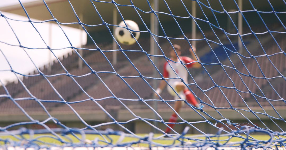 Soccer Player Shooting Goal in Empty Stadium - Free Images, Stock Photos and Pictures on Pikwizard.com