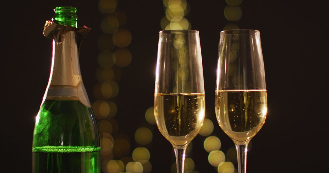 Champagne Toast with Bokeh Lights Celebrating New Year's Eve