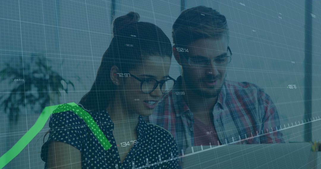 Diverse Team Analyzing Data and Digital Graphs in Modern Office