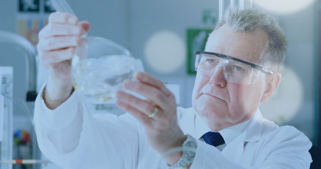 Senior Scientist Examining Flask in Modern Laboratory