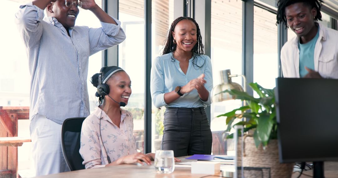 Team Celebrating Successful Project Presentation in Modern Office