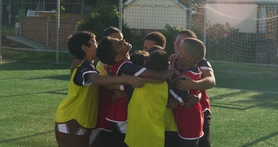 Youth Soccer Team Celebrating Victory in Group Hug on Field - Free Images, Stock Photos and Pictures on Pikwizard.com