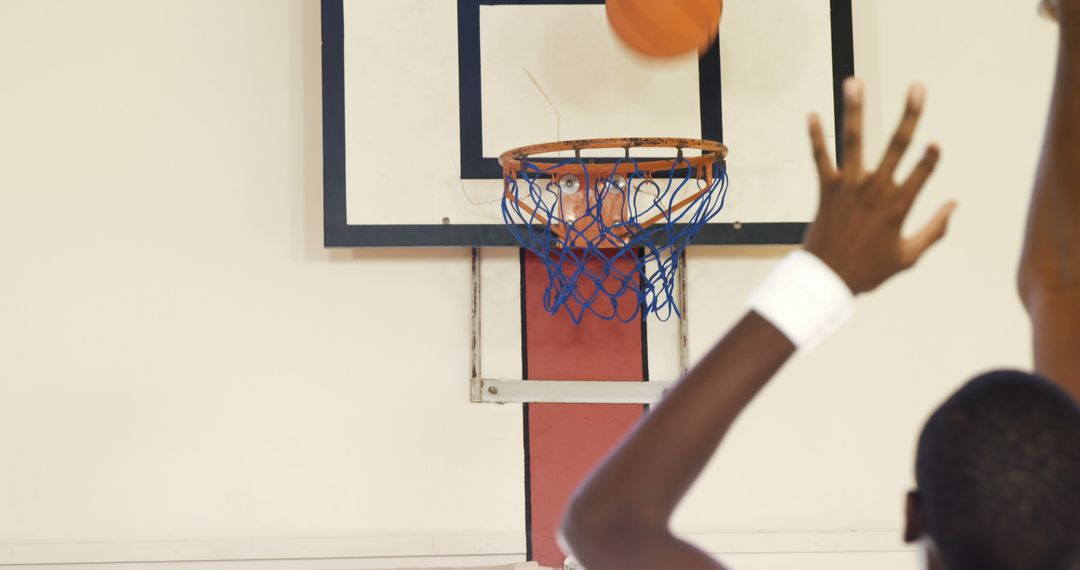 Basketball Player Aiming for Basket during Game indoors - Free Images, Stock Photos and Pictures on Pikwizard.com