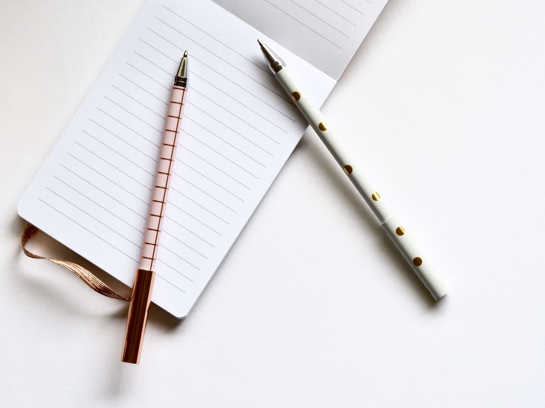 Minimalist Presentation of Notepad and Luxury Pens