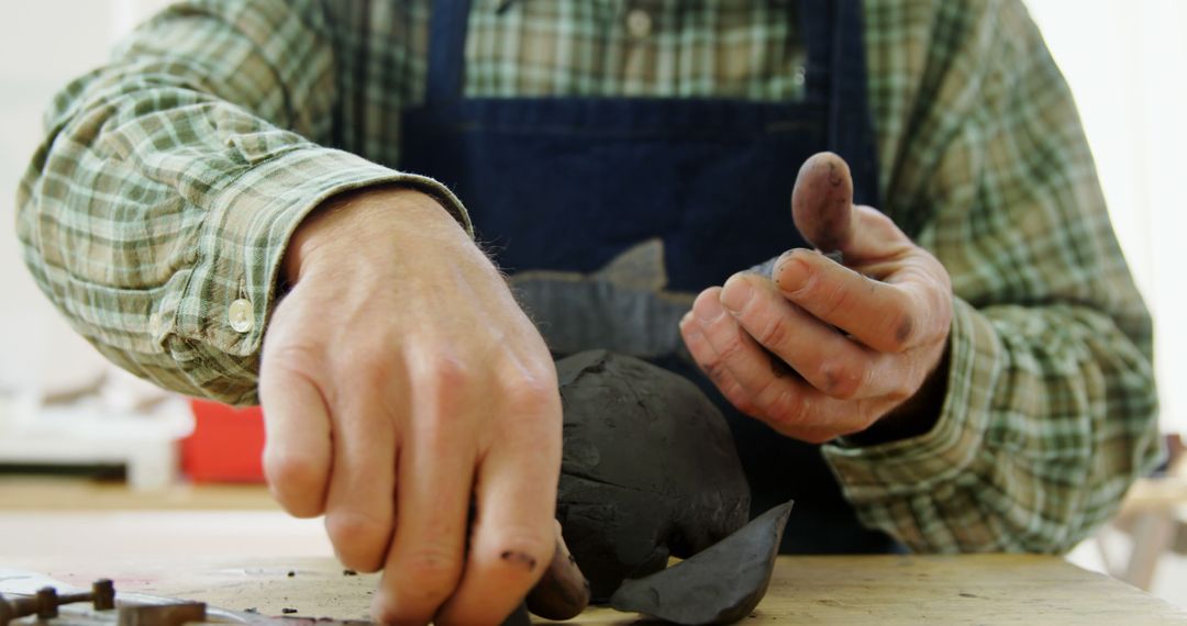 Sculptor Shaping Artwork in Workshop - Free Images, Stock Photos and Pictures on Pikwizard.com