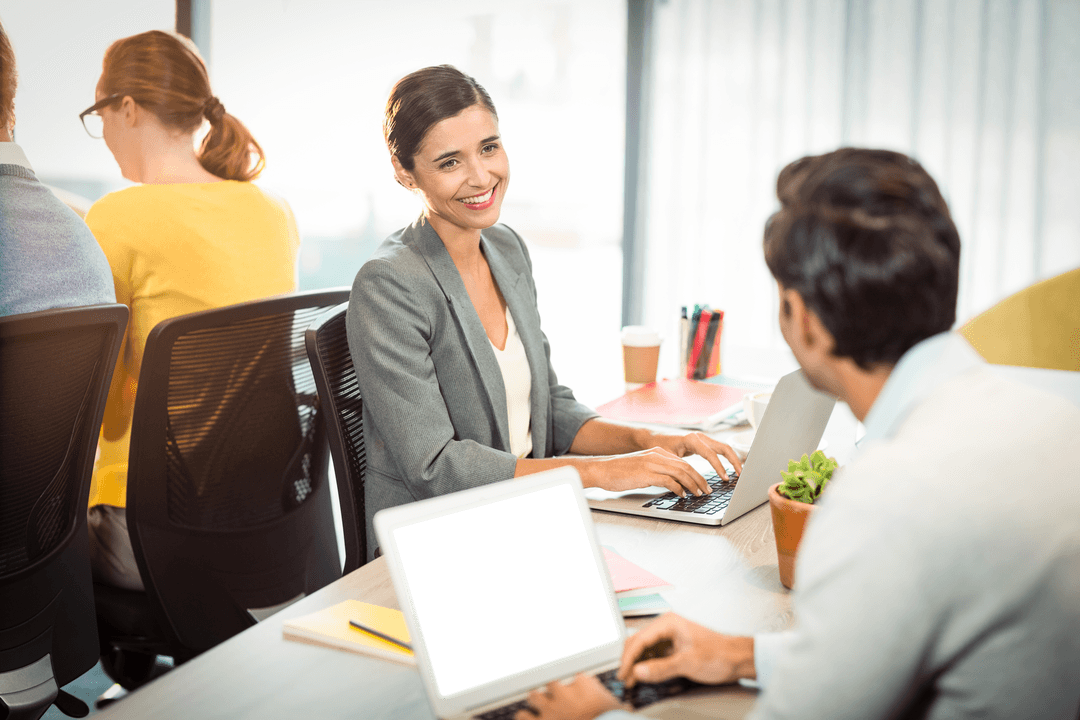 Transparent Colleagues Collaborating in Warm Office Atmosphere