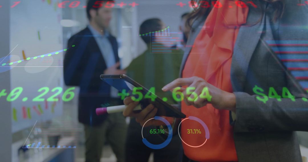 Businesswoman Using Tablet with Stock Data Overlay in Office