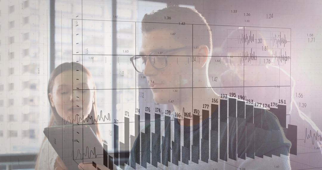 Colleagues Collaborating on Digital Data Analysis in Modern Office