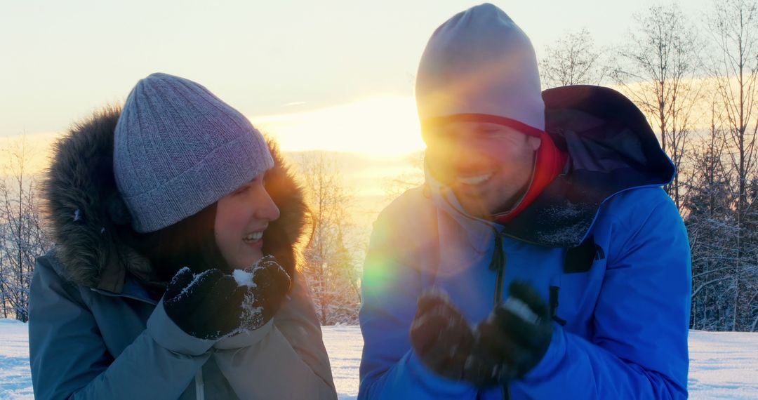 Couple Enjoying Winter Sunset in Snowy Landscape - Free Images, Stock Photos and Pictures on Pikwizard.com