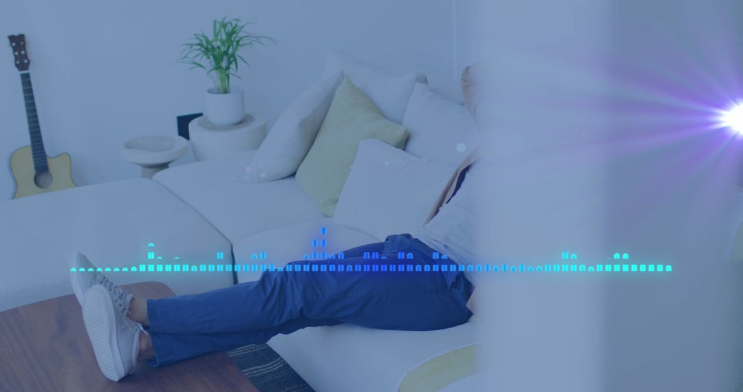 Man Relaxing on Sofa with Music Data Visualizer Overlay