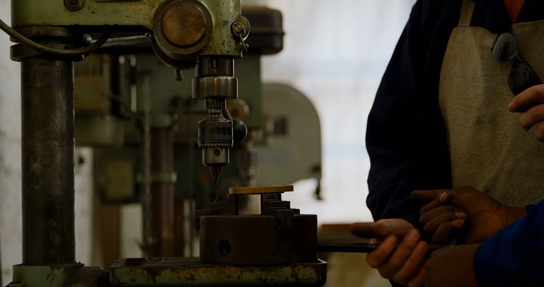 Machinists Operating Vertical Drilling Machine in Workshop - Free Images, Stock Photos and Pictures on Pikwizard.com