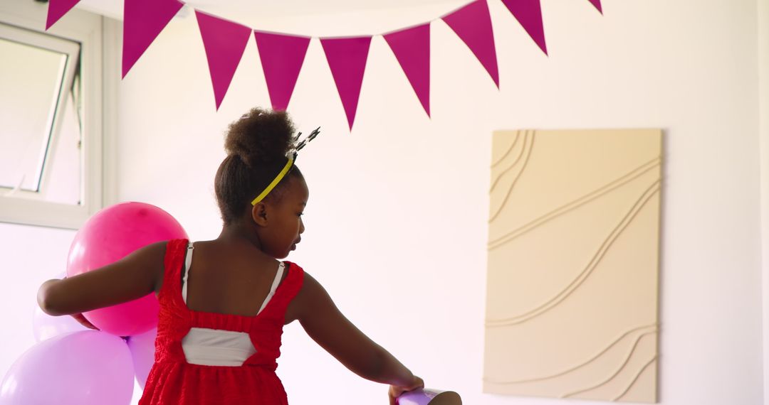 Man Hanging Pink Bunting in Cheerful Decor Atmosphere