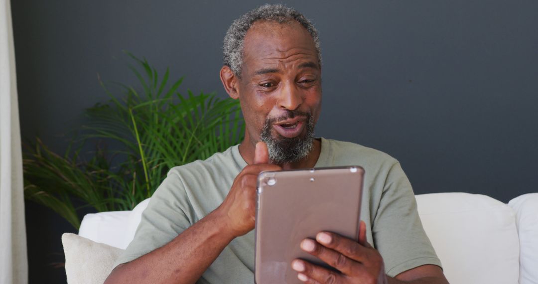 Senior African American Man Making Video Call on Tablet - Free Images, Stock Photos and Pictures on Pikwizard.com