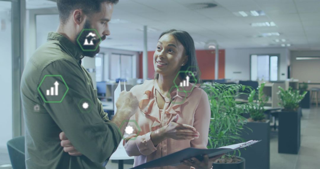 Colleagues Meeting in Modern Office with Digital Data Graphics