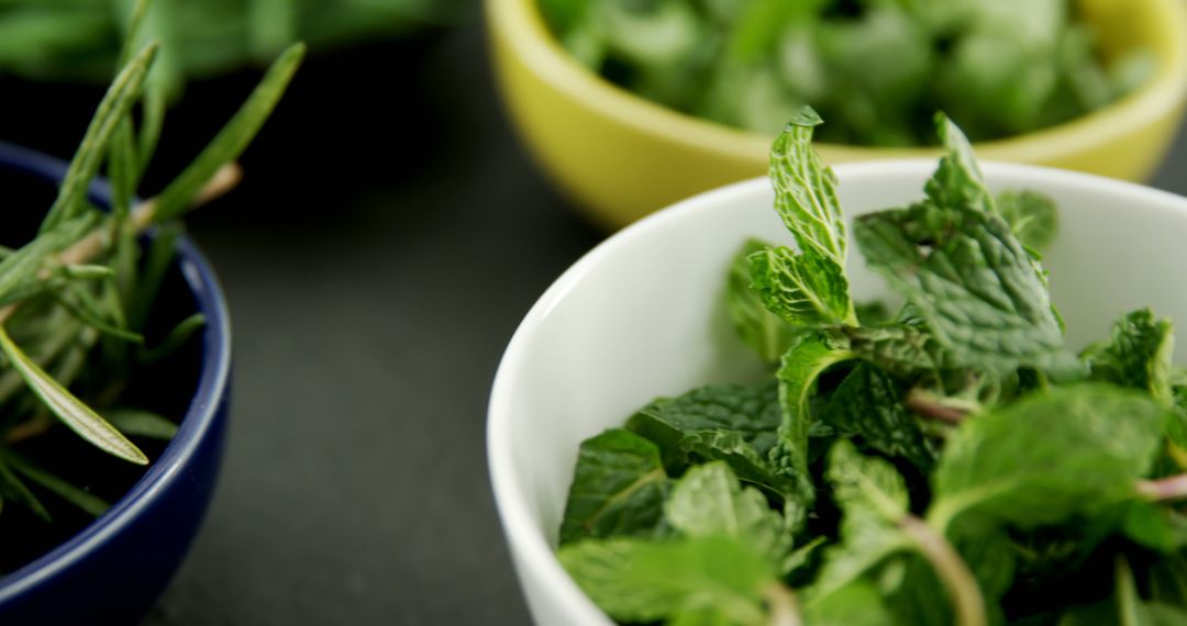 Fresh Mint Leaves in Ceramic Bowl with Blurred Background - Free Images, Stock Photos and Pictures on Pikwizard.com