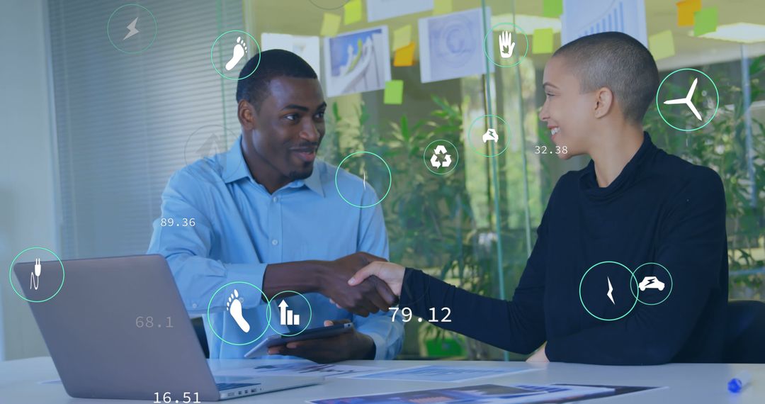 Diverse Professionals Shaking Hands in Modern Office Environment