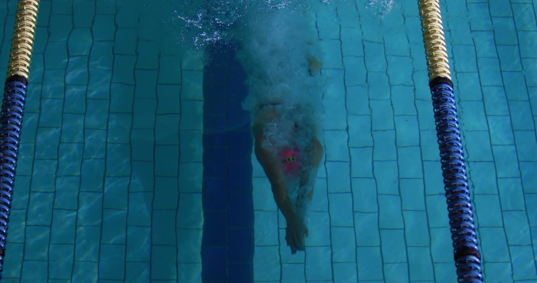 Underwater View of Swimmer in Race Enhancing Focus