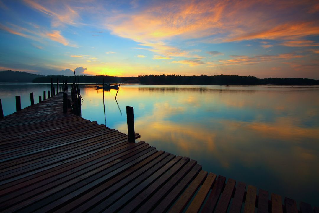 Serene Sunset Over Smooth Lake with Wooden Dock - Free Images, Stock Photos and Pictures on Pikwizard.com