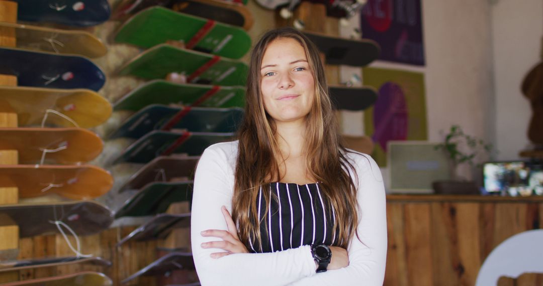 Confident Female Skateboard Shop Owner in Storefront - Free Images, Stock Photos and Pictures on Pikwizard.com