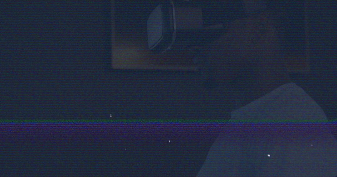 Man Engaged in Virtual Reality Immersion in Dark Environment