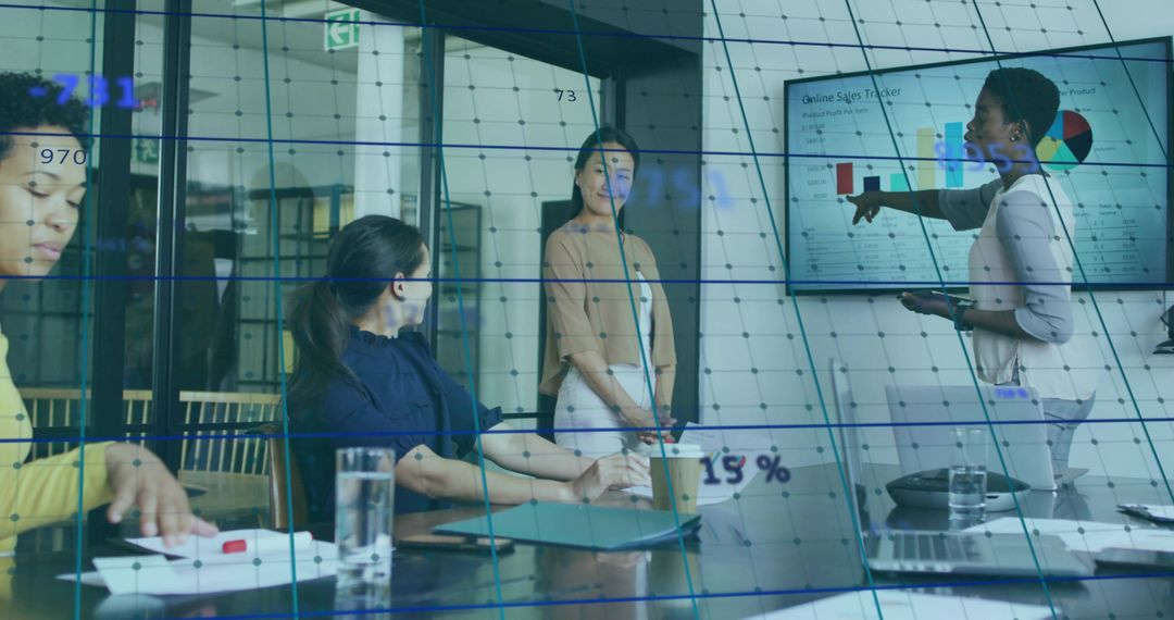 Business Team Collaborating on Sales Data Presentation