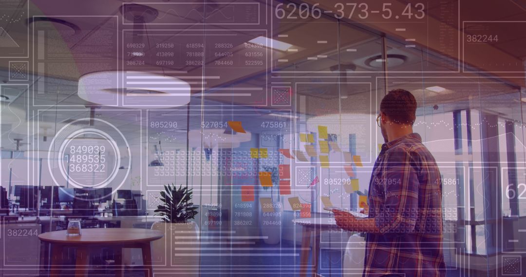 Businessman Analyzing Financial Data on Digital Interface at Modern Office