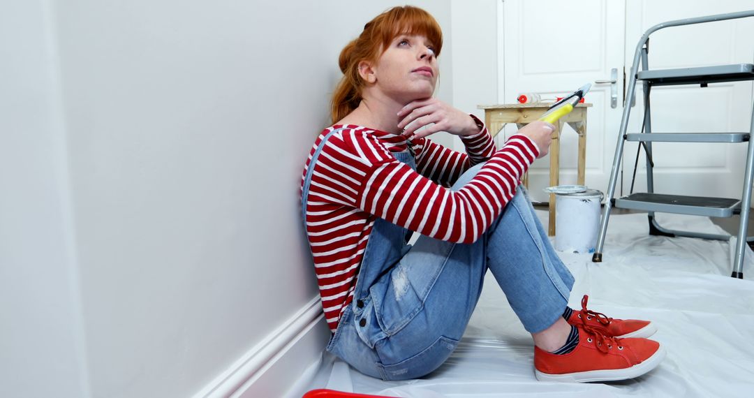 Contemplative Woman Sitting on Floor During Home Renovation - Free Images, Stock Photos and Pictures on Pikwizard.com