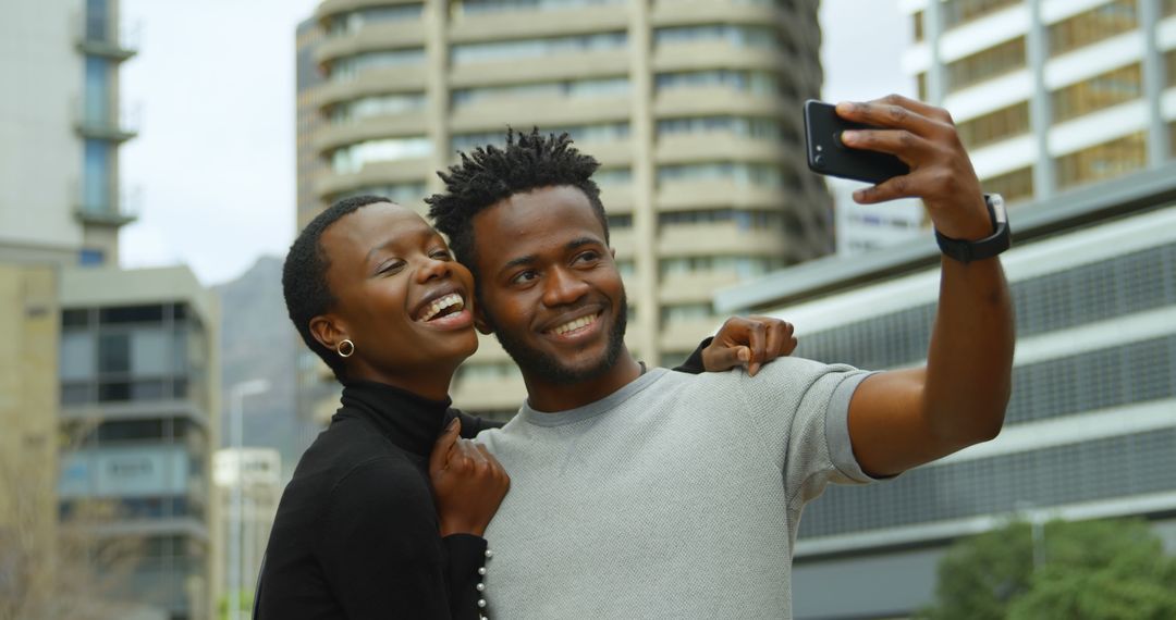 Happy Couple Taking Selfie in Urban Setting - Free Images, Stock Photos and Pictures on Pikwizard.com