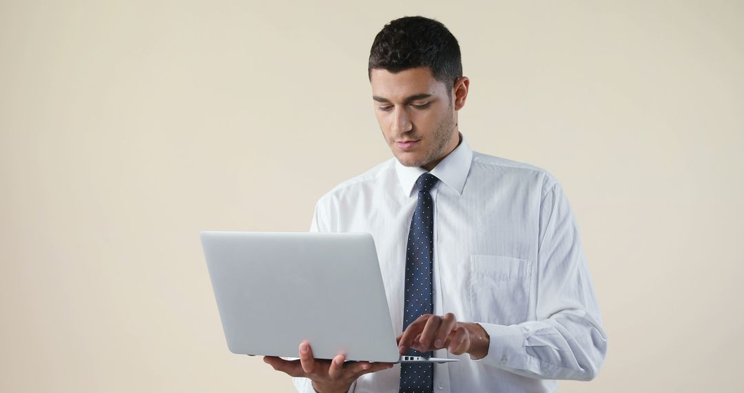 Businessman Working on Laptop in Office - Free Images, Stock Photos and Pictures on Pikwizard.com