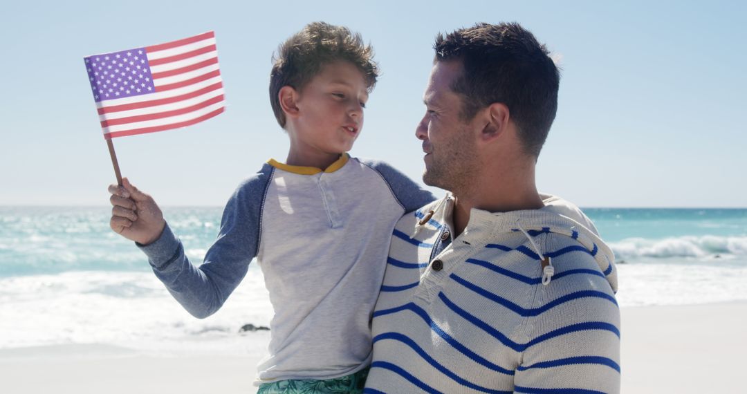 Father and Son Holding American Flag at the Beach - Free Images, Stock Photos and Pictures on Pikwizard.com