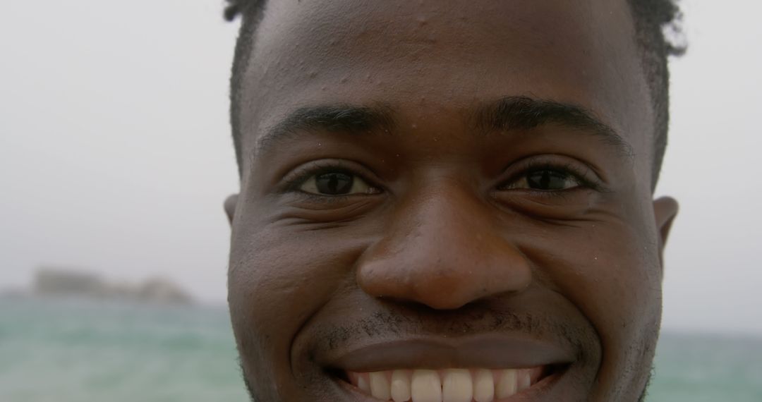 Smiling Man Enjoys Relaxing Beach Atmosphere