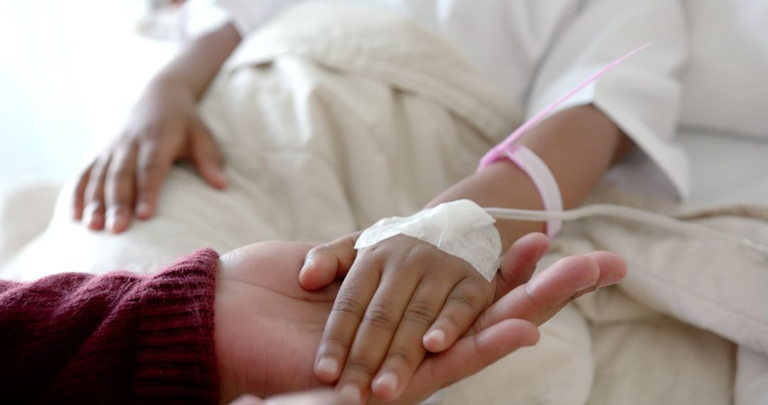 Child Patient Comforted by Parent in Hospital Bed - Free Images, Stock Photos and Pictures on Pikwizard.com