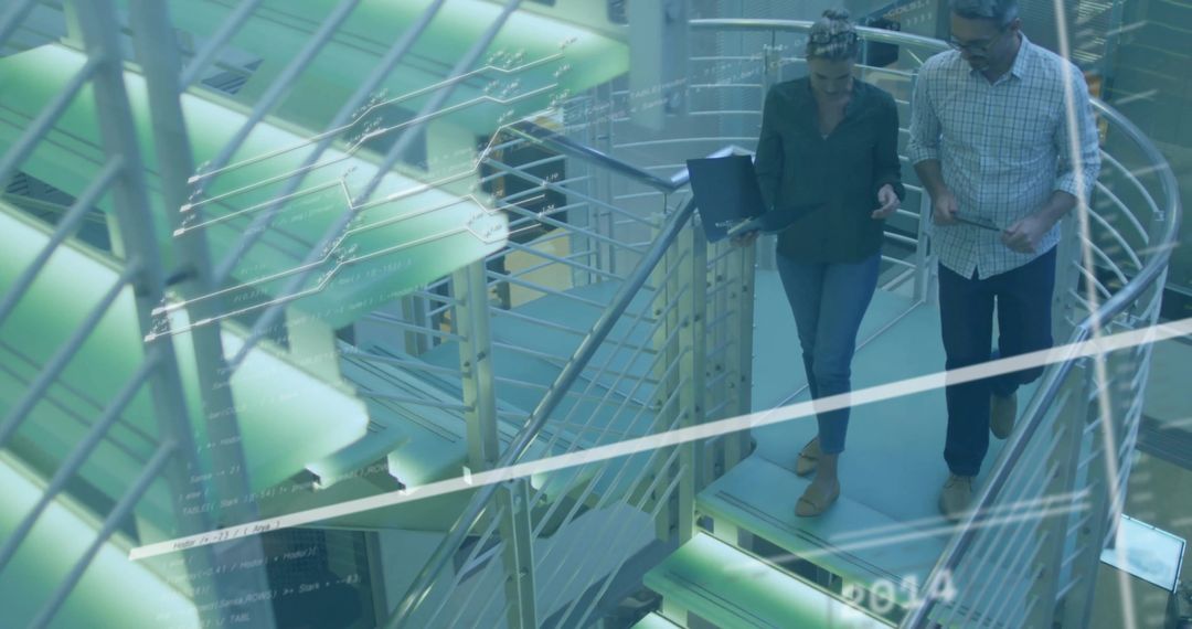 Innovative Professionals Collaborating on Digital Devices in Modern Office Atrium