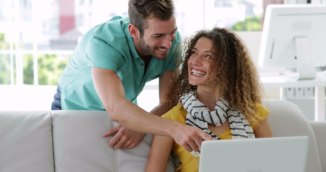Creative Team Collaborating on Project in Bright Modern Office