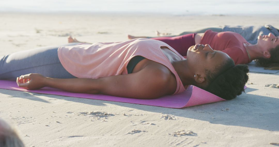 Diverse Women Practicing Yoga Relaxation on Beach - Free Images, Stock Photos and Pictures on Pikwizard.com