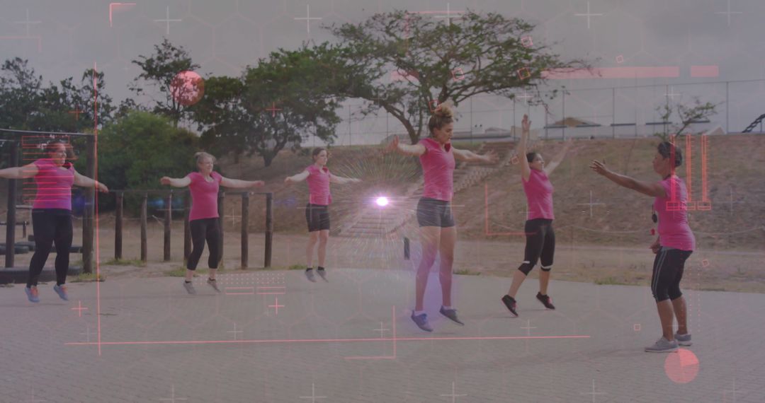 Women Engaged in Energetic Group Workout in Park Setting