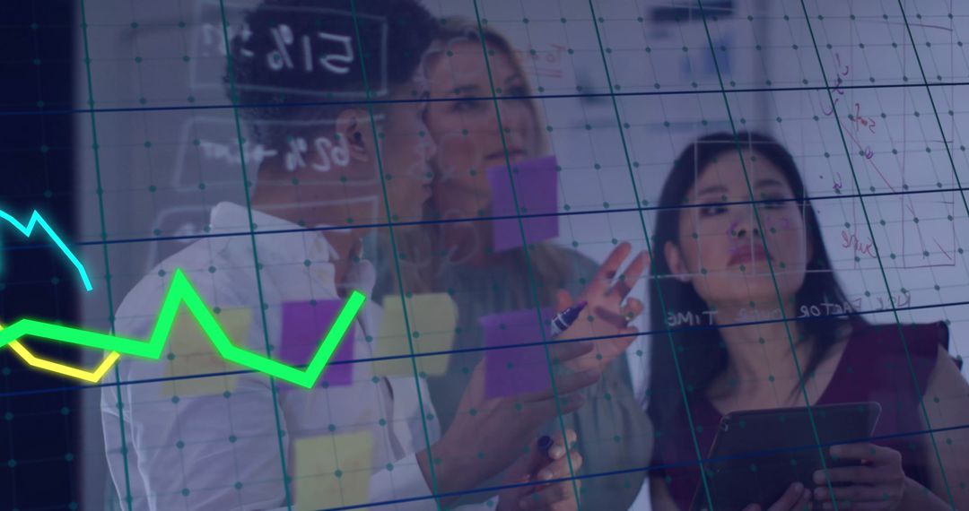 Diverse Business Team Analyzing Economic Data with Financial Graph Overlay