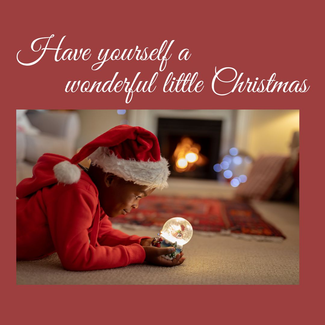 Young African American Boy Enjoying Christmas Indoors with Snow Globe - Download Free Stock Templates Pikwizard.com