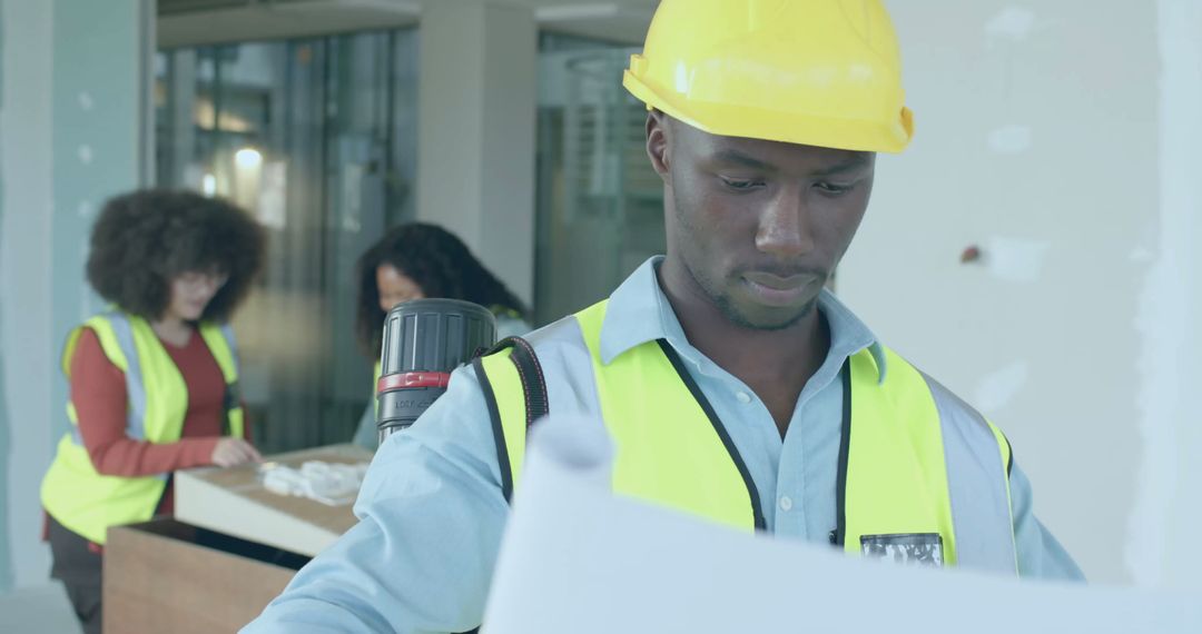 Professional Engineer Reviewing Construction Plans on Site