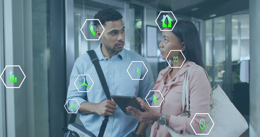 Diverse Colleagues Analyzing Eco-Friendly Data with Digital Tablet